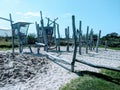 huge wooden playground with sand as a safetyground