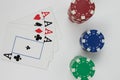playing ace cards and red blue green isolated poker chip stacks on a white background Royalty Free Stock Photo