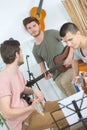 Playing acoustic and electric guitar together Royalty Free Stock Photo