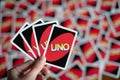 Playing american card game Uno, holding game cards in female hand. Royalty Free Stock Photo