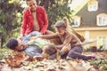 Playing at backyard at autumn season is fun. Happy family. Royalty Free Stock Photo