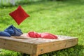 Playing bags in the backyard in summer