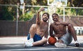 Playing ball does the body good. two sporty young men taking selfies on a basketball court. Royalty Free Stock Photo