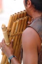 Playing bamboo flute Royalty Free Stock Photo