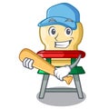 Playing baseball character baby eat on highchair indoors