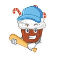 Playing baseball christmas cupcake isolated with the mascot
