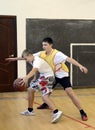 Playing basketball in gym class