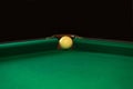 Playing billiard. Billiards balls and cue on green billiards table. Billiard sport concept. Pool billiard game. Russian pyramid Royalty Free Stock Photo