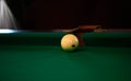 Playing billiard. Billiards balls and cue on green billiards table. Billiard sport concept. Pool billiard game. Russian pyramid Royalty Free Stock Photo