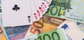 playing card above Euro paper banknotes, in a casino table, play and win concept Royalty Free Stock Photo