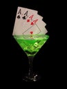 Playing card in a cocktail glass on black background. casino series Royalty Free Stock Photo