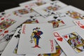 Playing card joker on the background of scattered cards Royalty Free Stock Photo