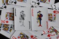 Playing card joker on the background of scattered cards Royalty Free Stock Photo