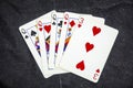 Five playing card`s a hand of a four of a kind queens and a three Royalty Free Stock Photo