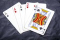 Five playing card`s a hand of a three of a kind ace`s and a two and a king Royalty Free Stock Photo