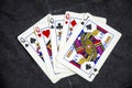 Five playing card`s a hand of a four of a kind jack`s and a queen Royalty Free Stock Photo