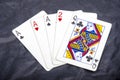 Five playing card`s a hand of a three of a kind ace`s and a two and a queen Royalty Free Stock Photo