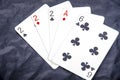 Five playing card`s a hand of a three of a kind two`s and a ace and a six