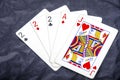 Five playing card`s a hand of a three of a kind two`s and a ace and a jack