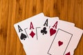 Playing cards aces card close up, isolated on wooden table. Casino concept, risk, chance, good luck or gambling Royalty Free Stock Photo