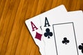 Playing cards aces card close up, isolated on wooden table. Casino concept, risk, chance, good luck or gambling Royalty Free Stock Photo