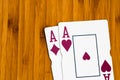Playing cards aces card close up, isolated on wooden table. Casino concept, risk, chance, good luck or gambling Royalty Free Stock Photo