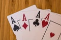 Playing cards aces card close up, isolated on wooden table. Casino concept, risk, chance, good luck or gambling Royalty Free Stock Photo