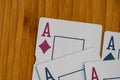 Playing cards aces card close up, isolated on wooden table. Casino concept, risk, chance, good luck or gambling Royalty Free Stock Photo