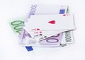 Playing cards aces over money Royalty Free Stock Photo