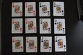 Playing cards arranged on black background