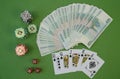 Playing cards in a combination of Flash Royal and poker chips on a green background. Texas Hold`em Poker. Gambling, business Royalty Free Stock Photo