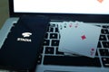 Playing cards and computer screen with the Google Stadia Royalty Free Stock Photo