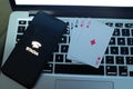 Playing cards and computer screen with the Google Stadia Royalty Free Stock Photo