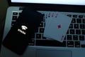 Playing cards and computer screen with the Google Stadia Royalty Free Stock Photo