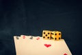 Playing cards and dice on black background Royalty Free Stock Photo