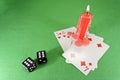 Playing cards, dice and a candle Royalty Free Stock Photo