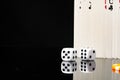 Playing cards and dice cubes on black background close up Royalty Free Stock Photo