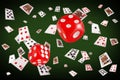 Playing cards and dice flying at the poker table Royalty Free Stock Photo