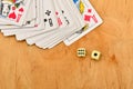 Playing and cards dice wooden background.