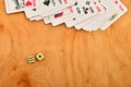 Playing and cards dice wooden background.