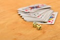 Playing and cards dice wooden background.