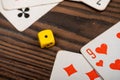Playing cards and dice on a wooden table Royalty Free Stock Photo