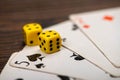 Playing cards and dice on a wooden table Royalty Free Stock Photo