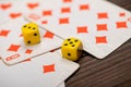 Playing cards and dice on a wooden table Royalty Free Stock Photo