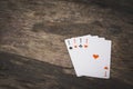 Playing cards four aces on the wooden table Royalty Free Stock Photo