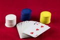 Playing Cards and Gaming Chips on a Red Background Royalty Free Stock Photo