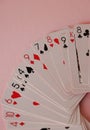 Playing cards - isolated on pink background Royalty Free Stock Photo