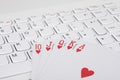 Playing cards lying on computer keyboard Royalty Free Stock Photo