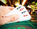 Playing cards in a man hand in the casino