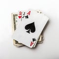 Playing cards and money stack isolated on white background Royalty Free Stock Photo